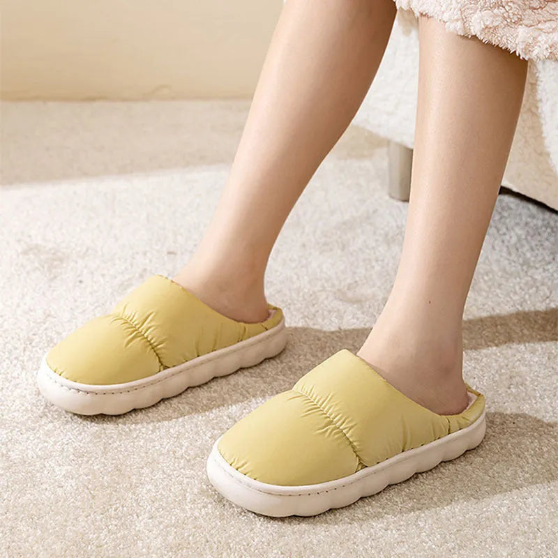 Down cotton indoor slippers with artificial leather upper and rubber sole in various colours