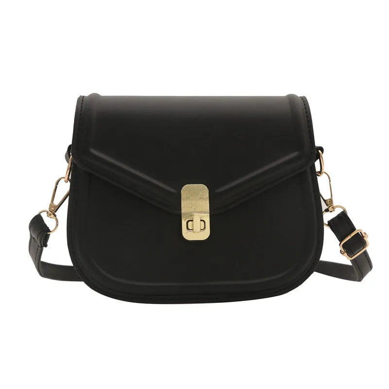 Soft textured PU shoulder messenger bag in horizontal square clamshell design.