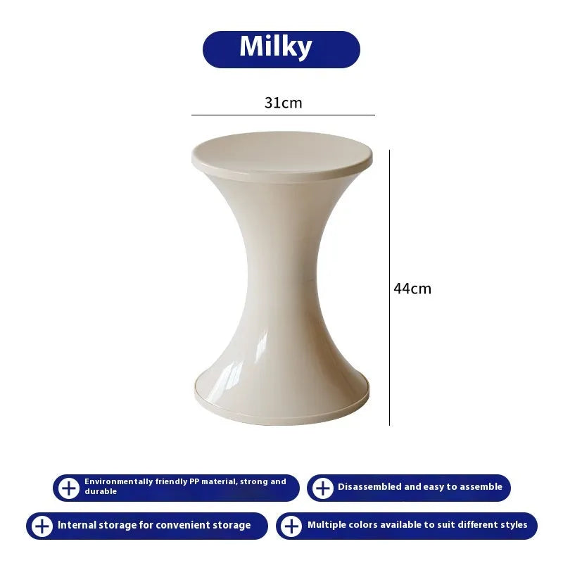 A plastic hourglass-shaped stool for changing shoes, shown in one of five available colours.