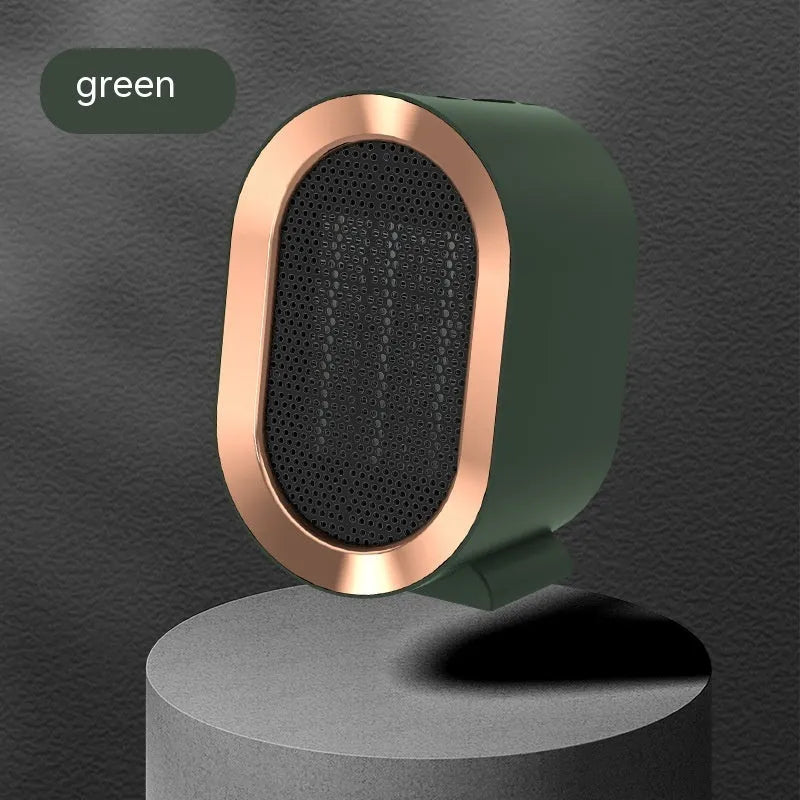 Desktop ceramic fan heater in black with mechanical control knobs and a front grille.