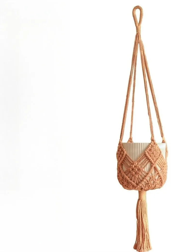 Hand-woven polyester cotton flower pot net pocket in brown, hanging with a green plant.