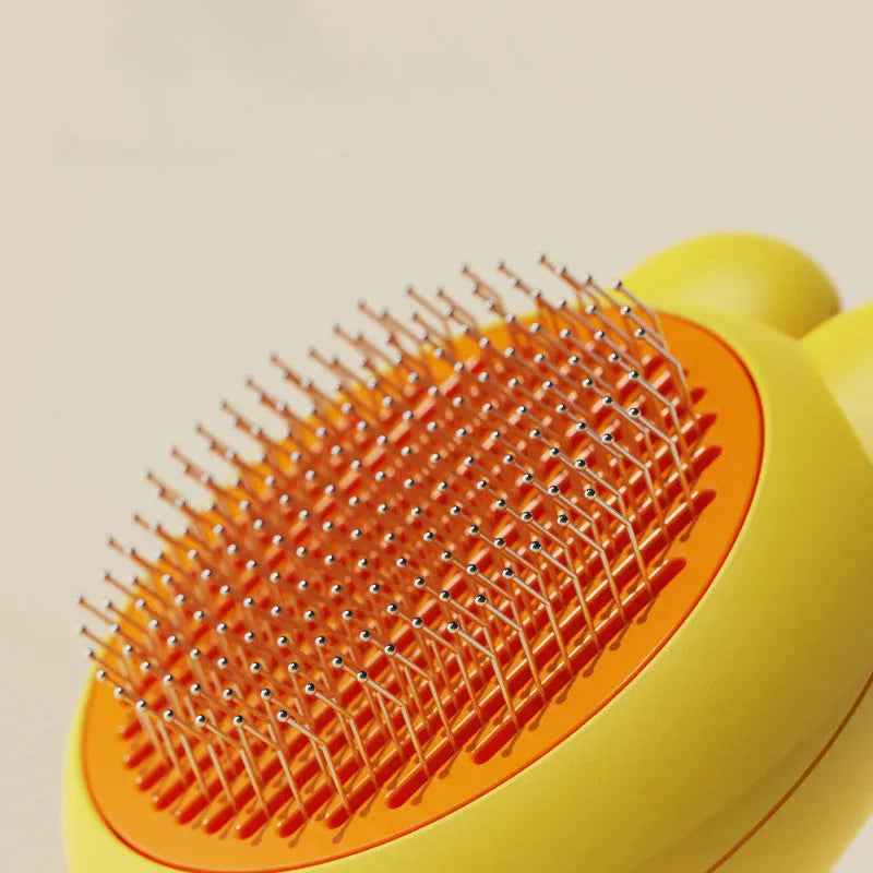 Green self-cleaning pet grooming brush with release button and stainless steel comb on a white background