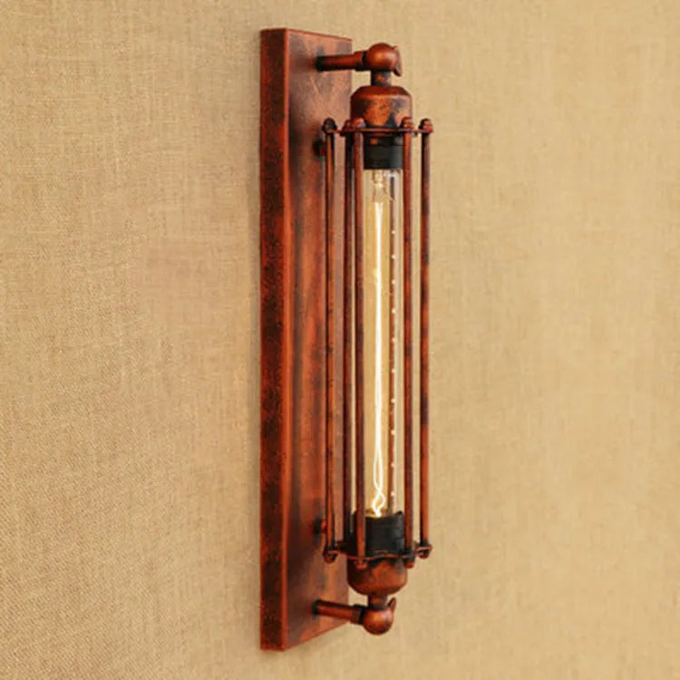 Industrial retro iron wall lamp in antique style with elongated flute-shaped shade.
