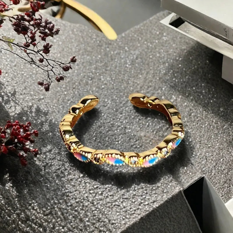 Adjustable copper gourd ring with flower and bow design in New Chinese style featuring inlaid zircon stones