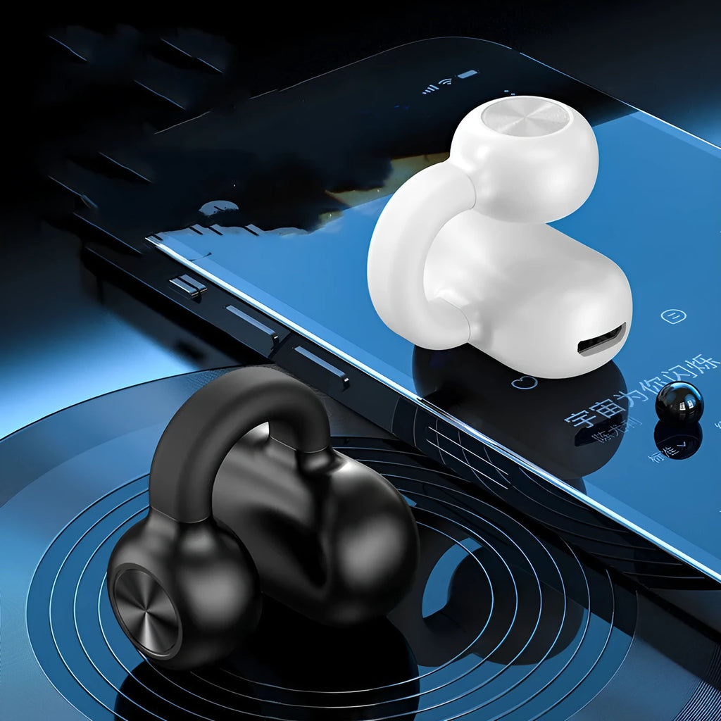 Black wireless Bluetooth clip-on earphones with bone conduction technology displayed beside charging cable