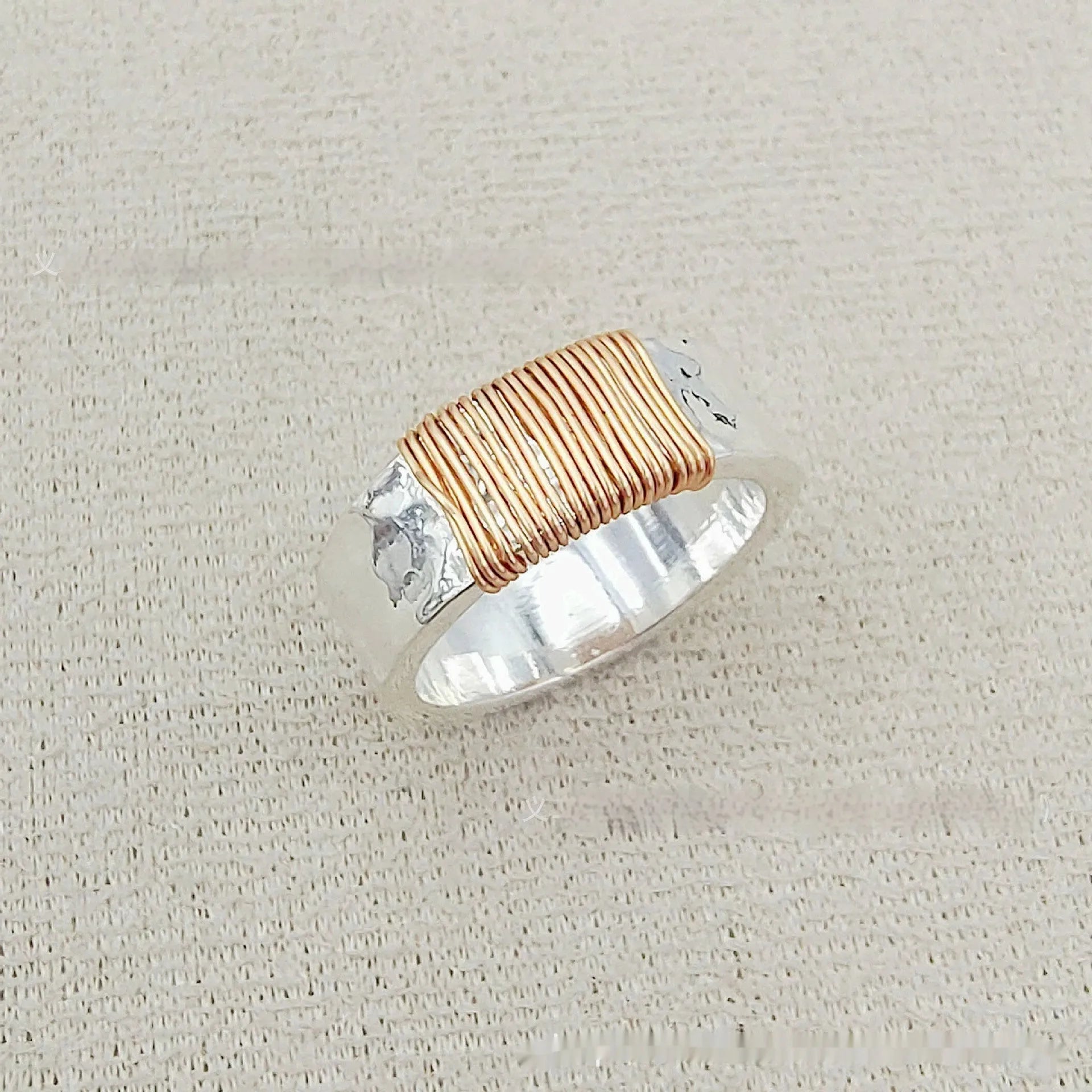 Wide-faced copper geometric bracelet with silver gold electroplated coil finish