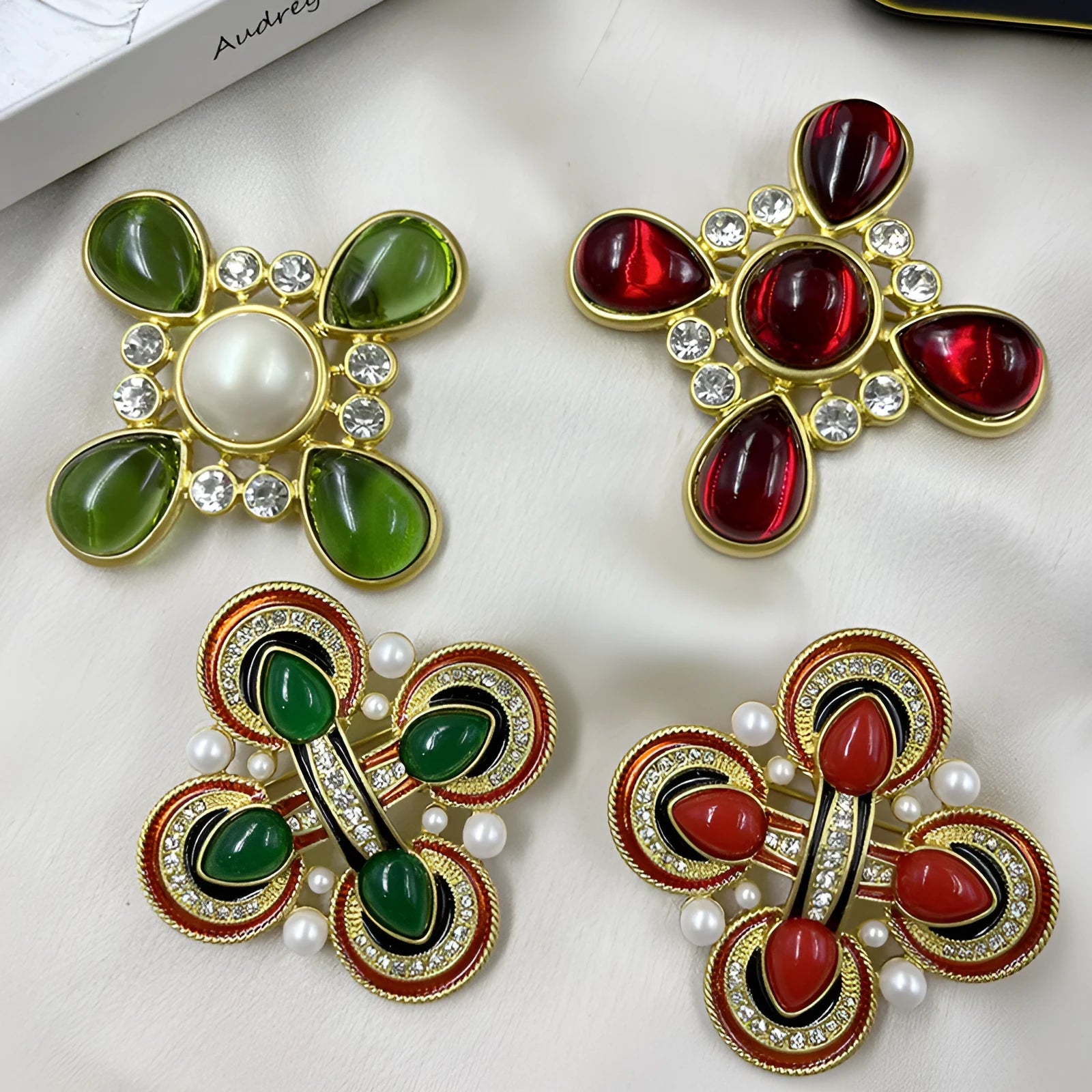 Close-up of vintage medieval baroque cross brooch with crystal details on zinc alloy base