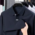 Men's grey cotton polo shirt with lapel collar and long sleeves showing loose fit design