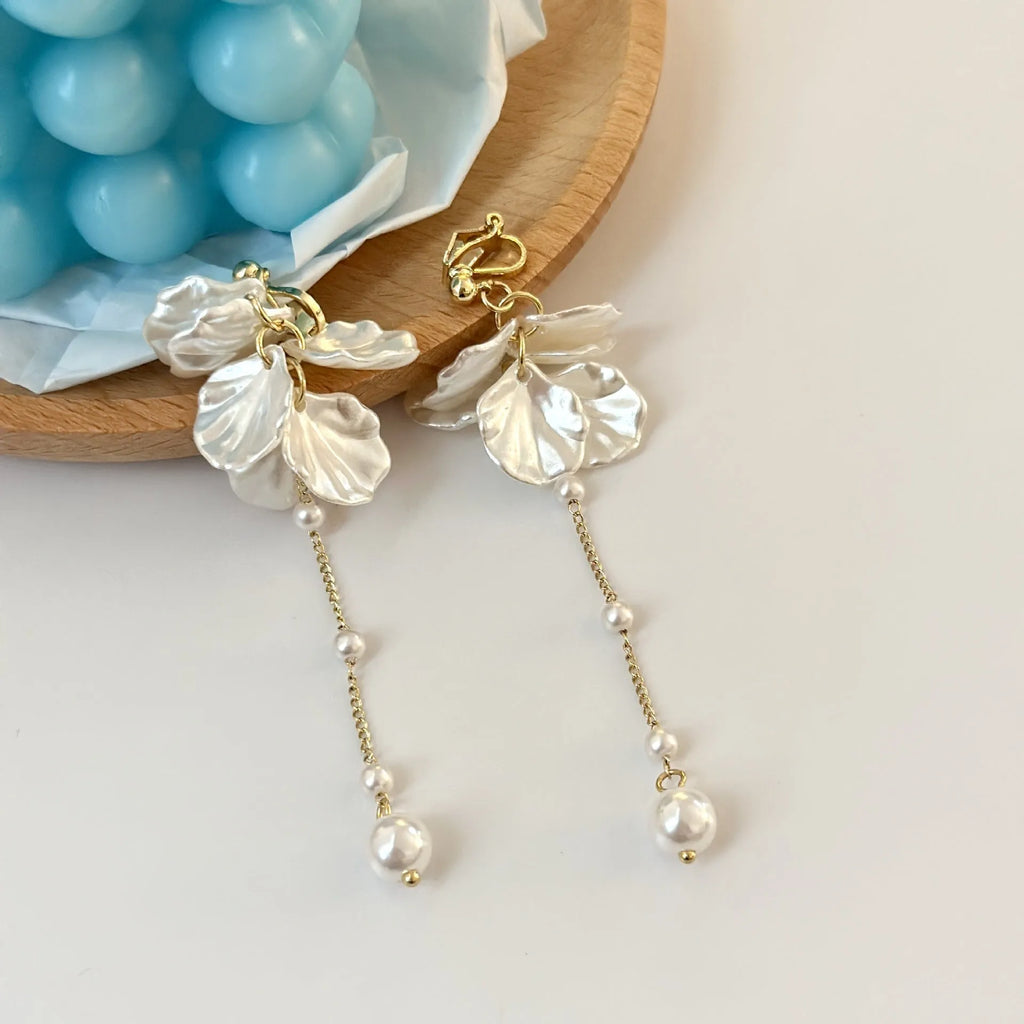 Women's acrylic shell pearl tassel earrings showing length, with a choice of four ear clip types.