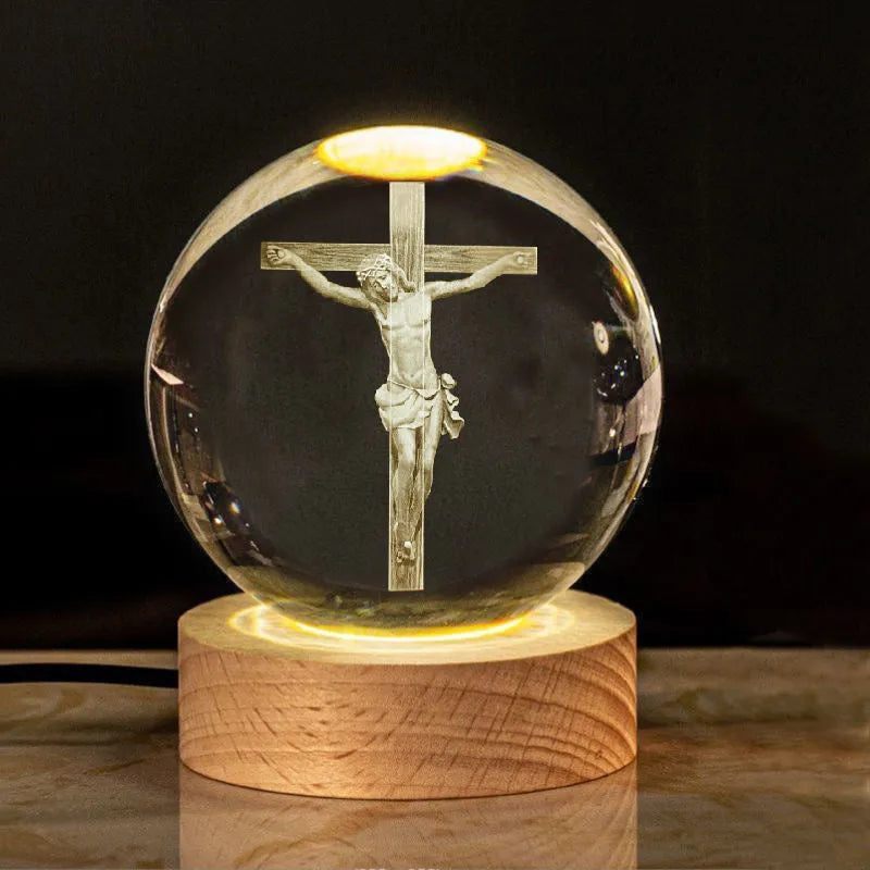 White crystal ball desk lamp on wooden base with warm light, showing religious symbol options.