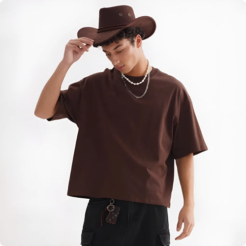American style loose fit pure cotton t-shirt in apricot colour on a hanger.