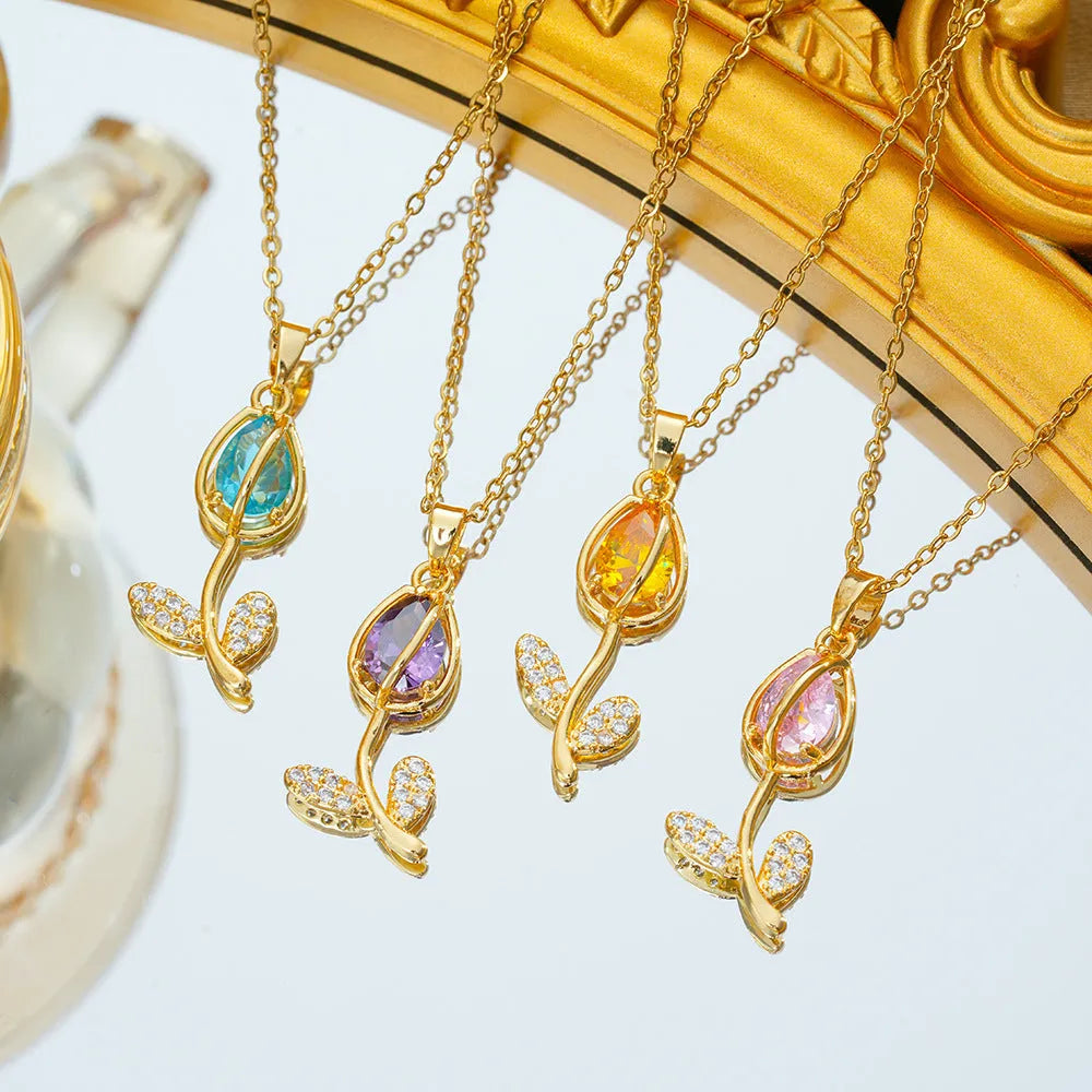 Gold electroplated titanium steel tulip necklace with adjustable chain and floral pendant