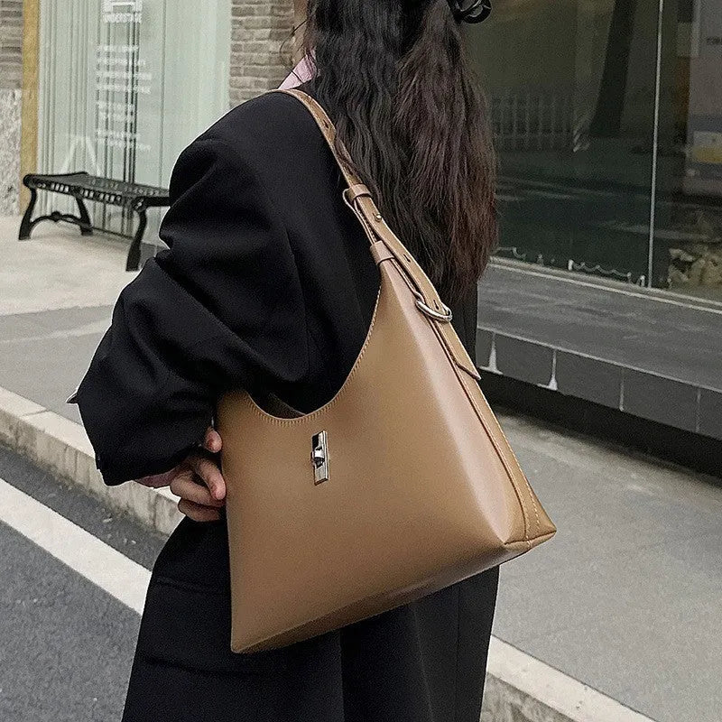 Genuine leather dumpling-shaped crossbody bag with multiple compartments in apricot colour