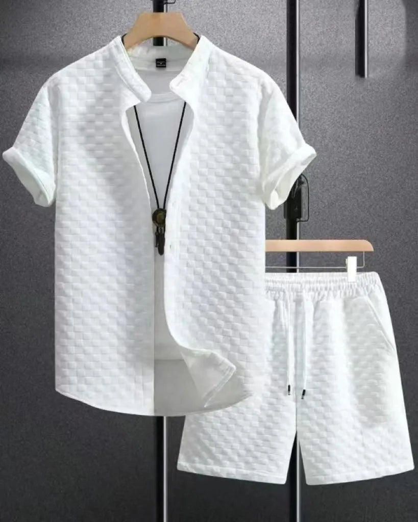Man wearing black and white jacquard print short sleeve suit with shirt-style jacket and matching shorts