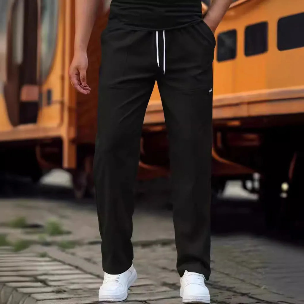 Men's straight-leg lightweight polyester trousers in light grey colour, laid flat showing front design