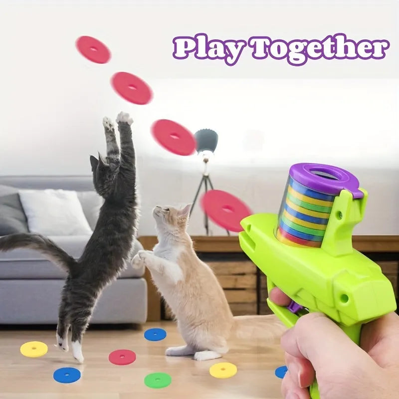 Interactive cat toy launcher with foam disc in green or purple colour
