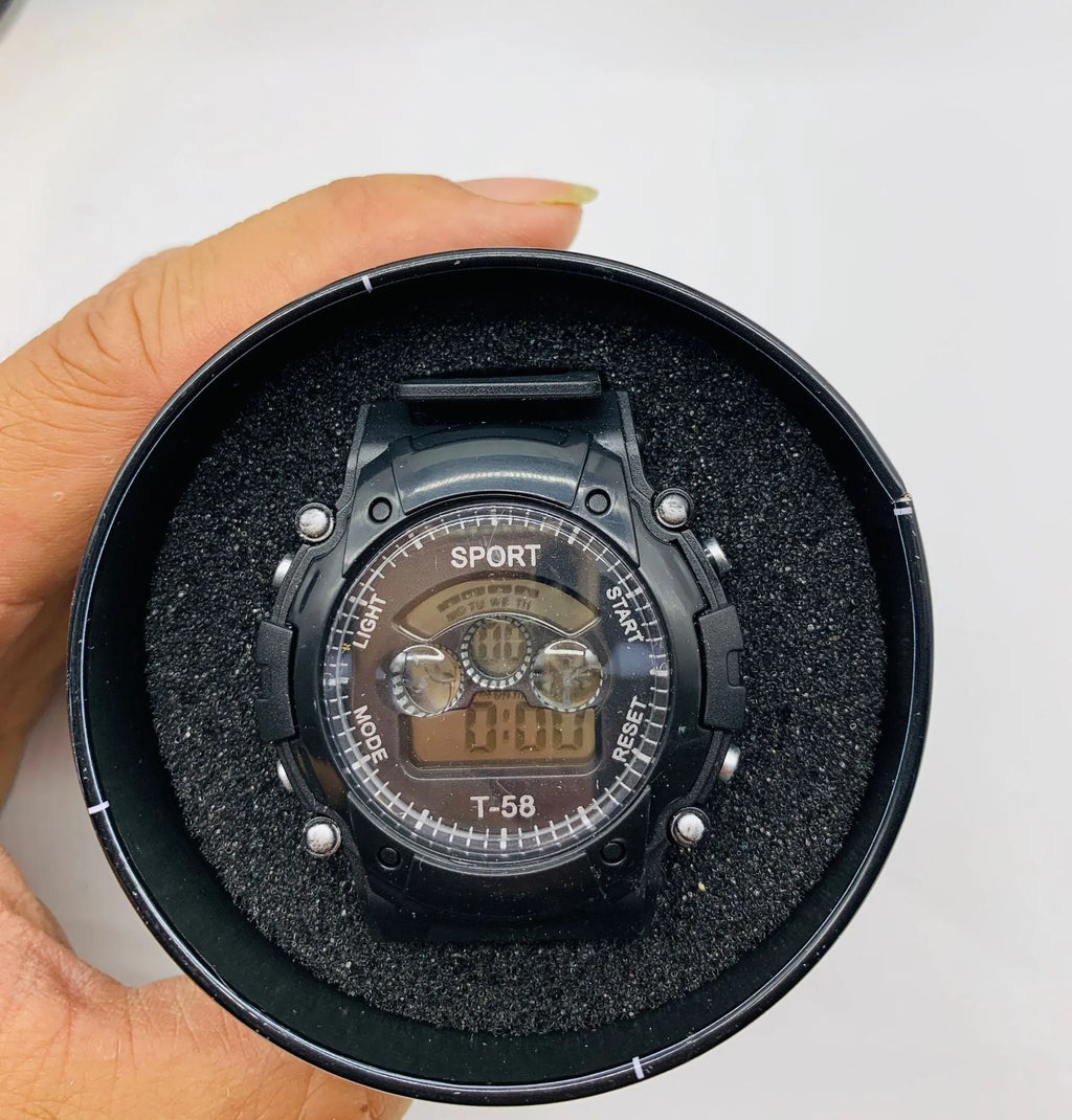 Children's digital sports watch with black silicone strap and digital display showing time