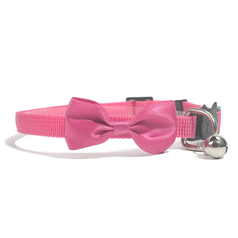 Adjustable nylon cat collar with decorative bow and bell in multiple colour options including red, blue, pink and green