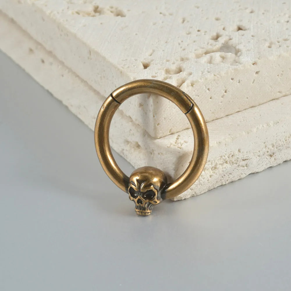 Punk copper earrings with vintage ghost head design in antique gold finish