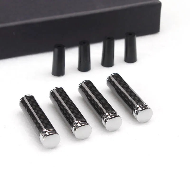 Set of four carbon fibre and metal car door lift handle covers for direct replacement installation.