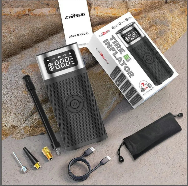 Black portable wireless vehicle air pump with inflatable tube and nozzles on a storage bag