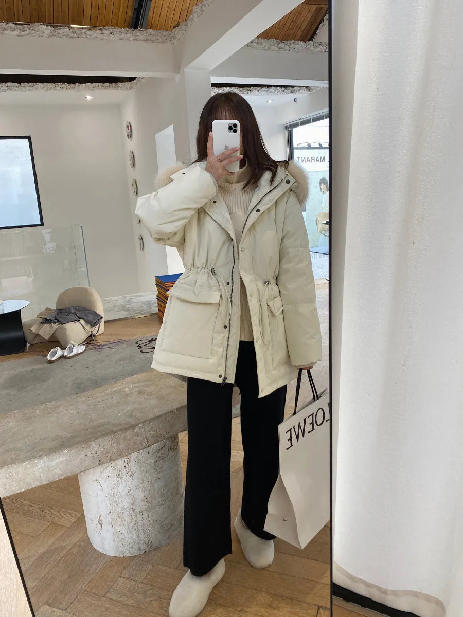 Women's cream white high waist wide-leg knitted trousers with a long mopping hem and elastic waistband.