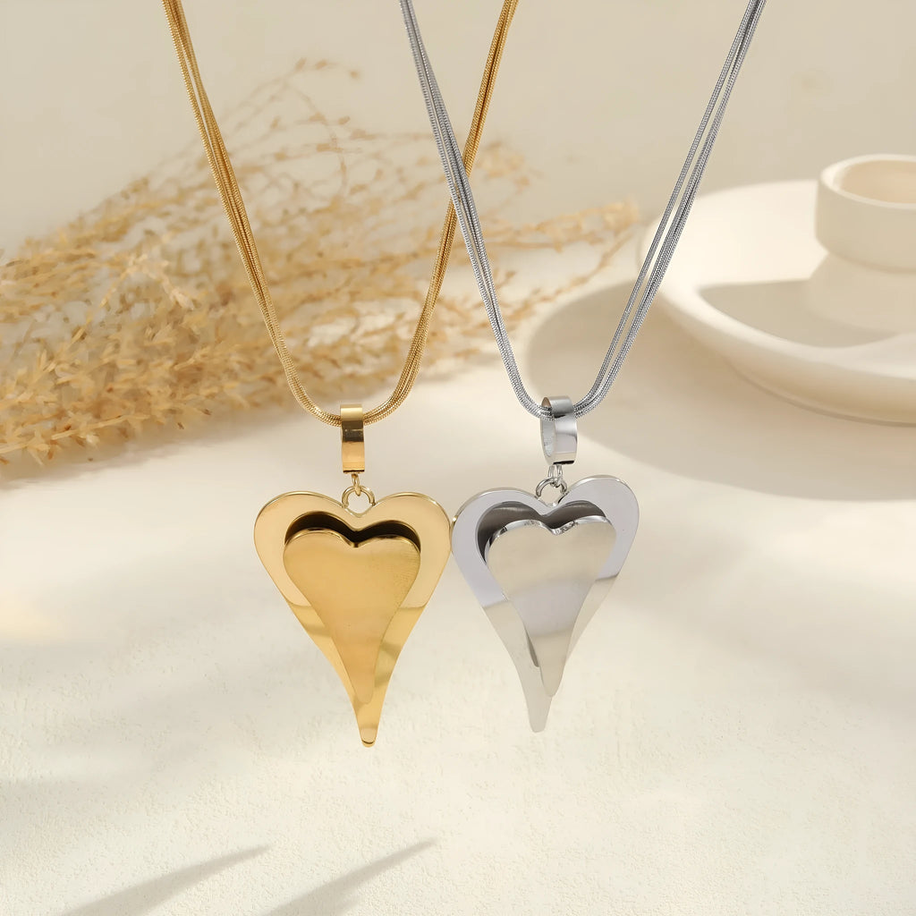 Gold stainless steel necklace with double heart pendant on snake bones chain