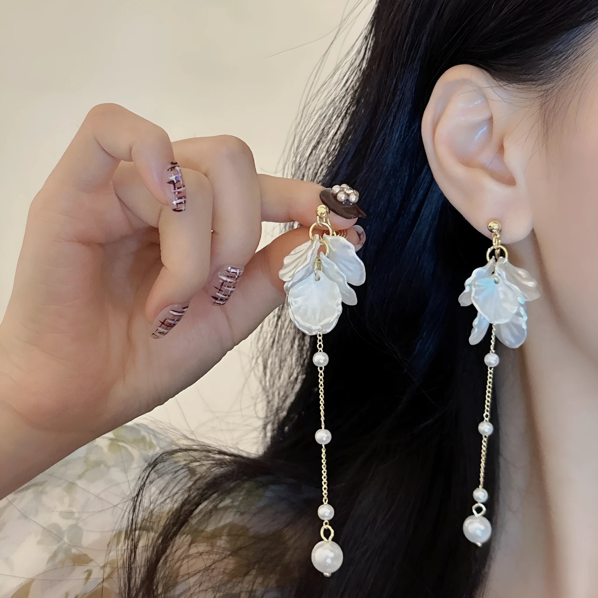 Women's acrylic shell pearl tassel earrings showing length, with a choice of four ear clip types.
