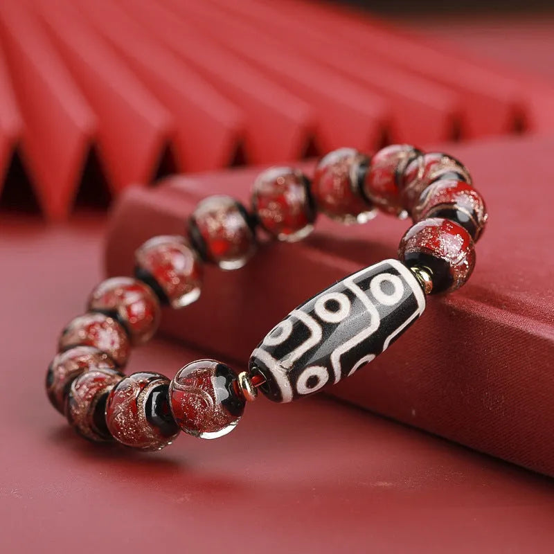 Chinese-style bracelet with colourful glazed beads showing snake patterns, available in 10mm 12mm or 14mm sizes