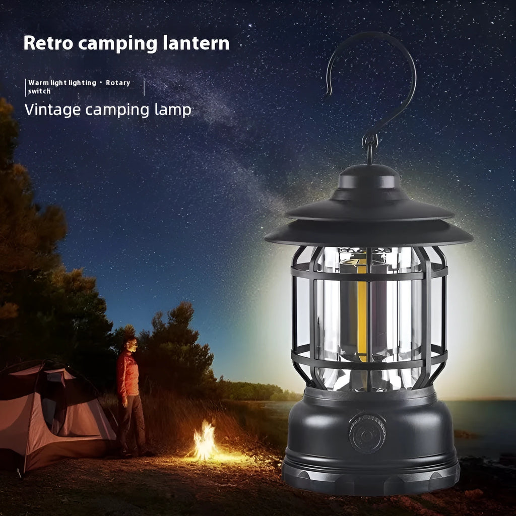 Dark green portable camping lantern with super bright LEDs, shown with a dry battery for scale.