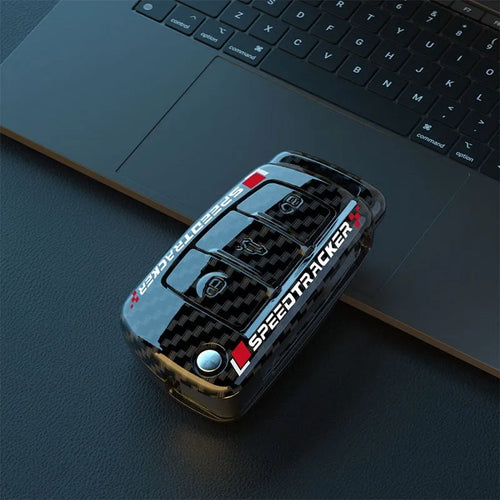 Carbon fibre style car key holder cover in white and carbon colour options with a small mirror.