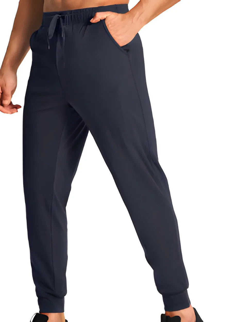Men's loose-fit solid colour casual trousers on a hanger, showing the relaxed leg cut.
