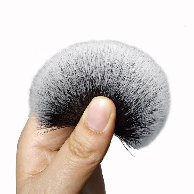Black car detailing brush with super soft pig hair bristles shown in large and small sizes.