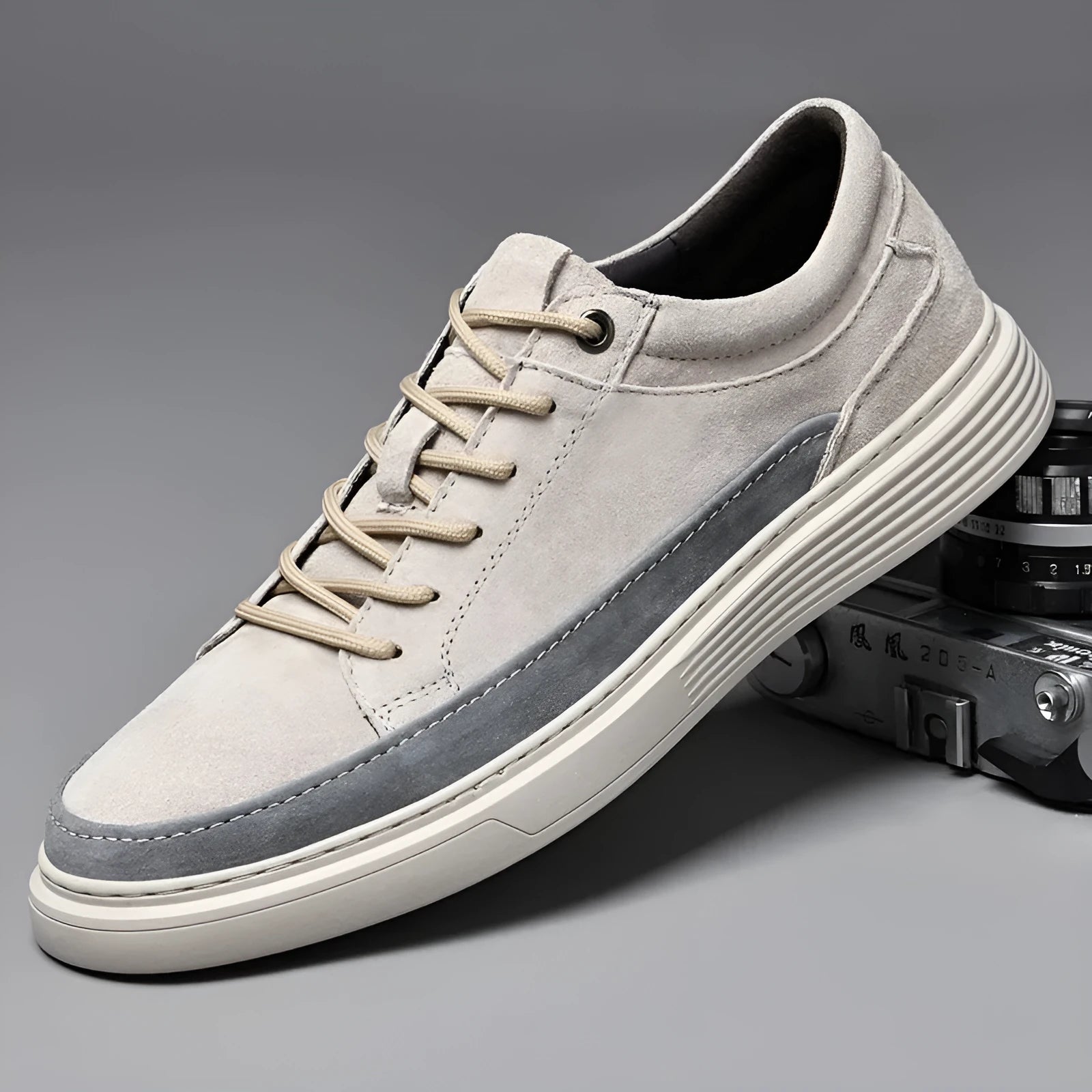 Men's grey and sand coloured low-top casual skate shoes with round toe and lace-up front.