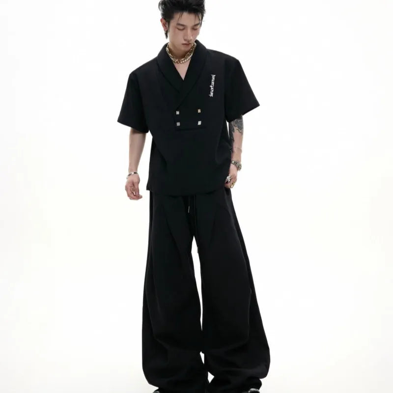Men's dark grey cotton V-neck sports suit with padded shoulder short sleeve jacket and matching shorts.