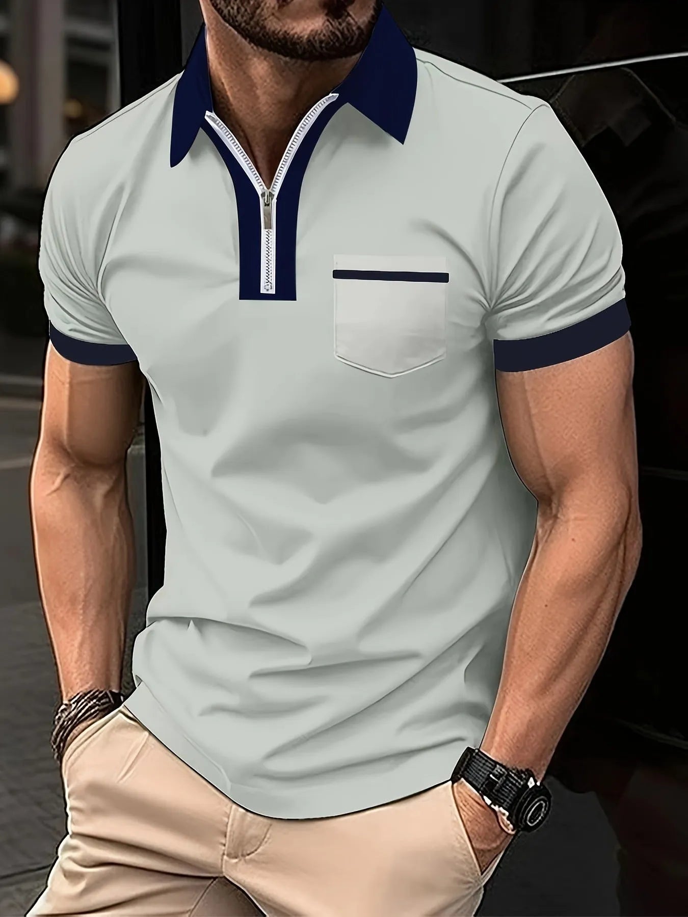 Men's loose-fit casual short-sleeve shirt with a chest pocket and zipper detail on the front.