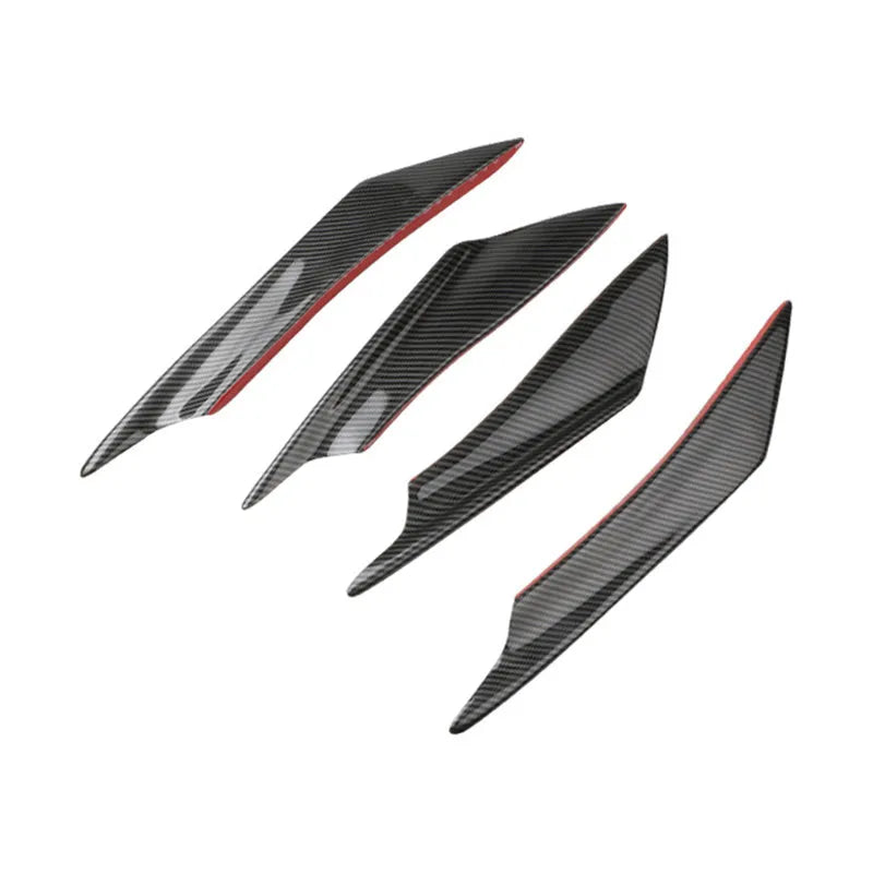 Set of four carbon fibre effect ABS plastic bumper air knife spoilers for car styling.