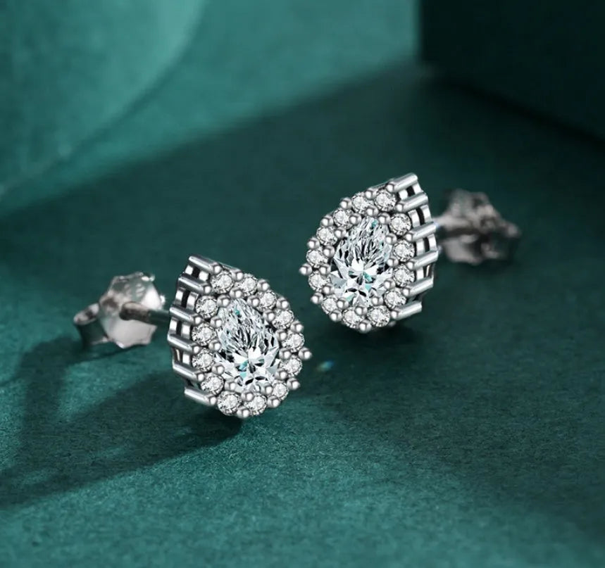 Women's silver water drop ear studs in 925 sterling silver with diamond treatment