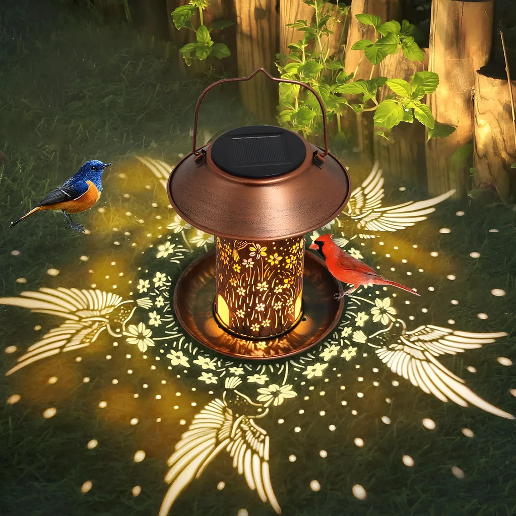 Solar-powered iron bird feeder with hummingbird pattern and integrated LED light for outdoor gardens
