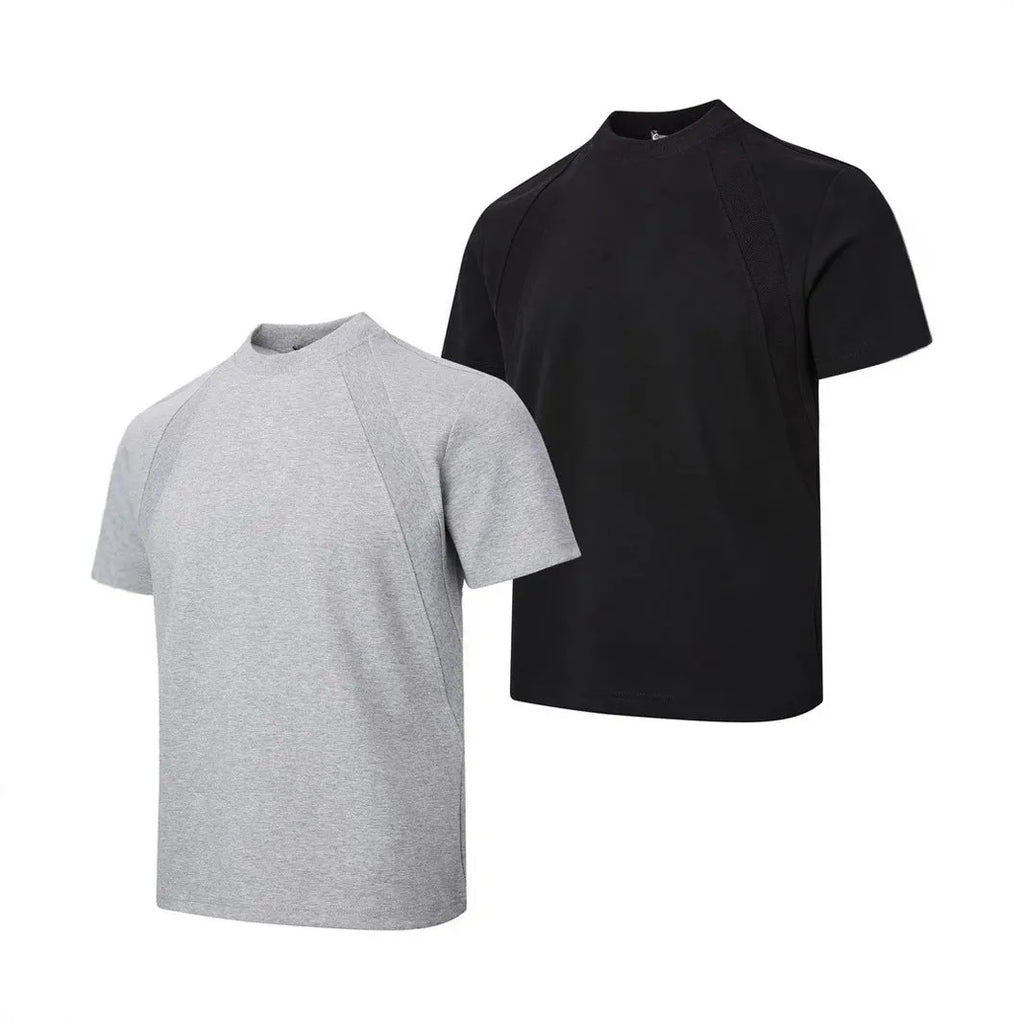 Man wearing a black loose-fit short sleeve top with visible air layer stitching texture.