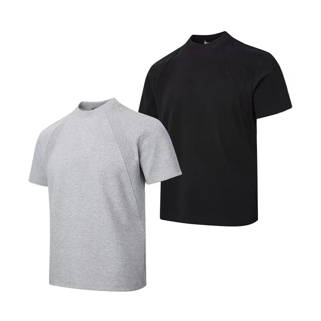 Man wearing a black loose-fit short sleeve top with visible air layer stitching texture.