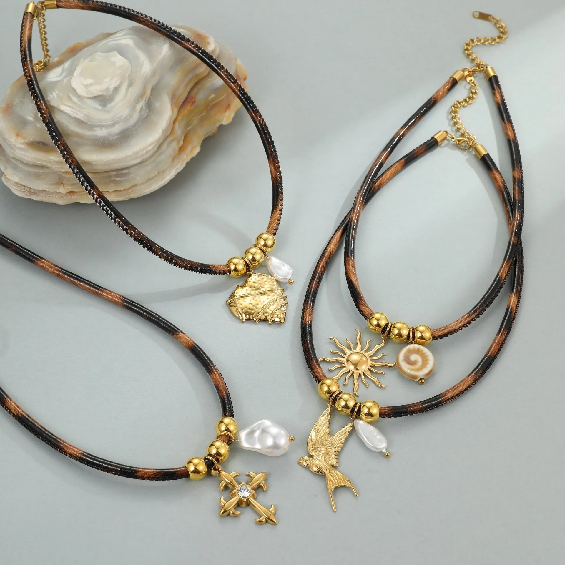Geometric leopard pendant necklace on stainless steel chain with gold electroplated finish