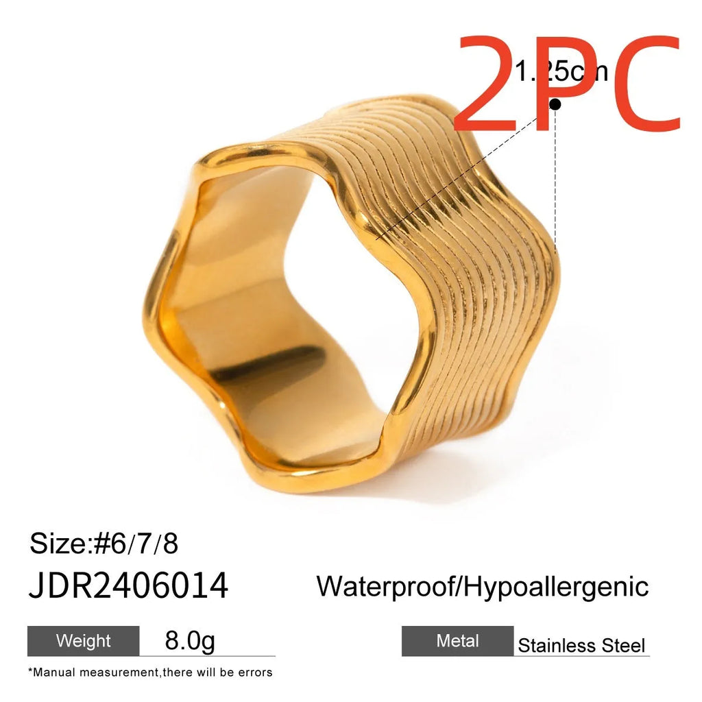 Stainless steel women's ring with geometric wide wave design and electroplated finish.