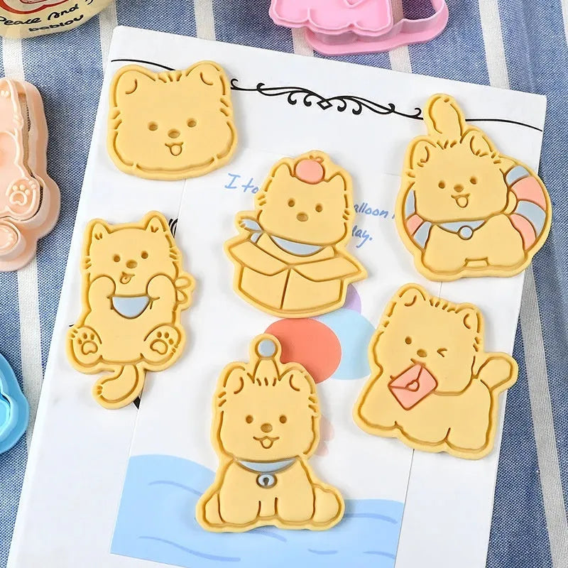 Plastic biscuit mould showing three-dimensional puppy head design with birthday hat for baking