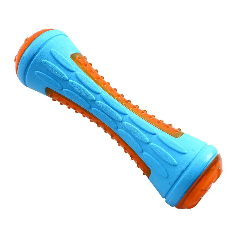 Set of three dog toys: a red ball, a blue barbell, and an orange tyre, floating in water.