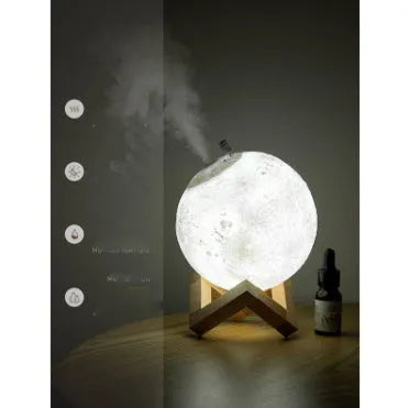 Lunar sphere humidifier and night light in wood finish with white LED light on a bedside table