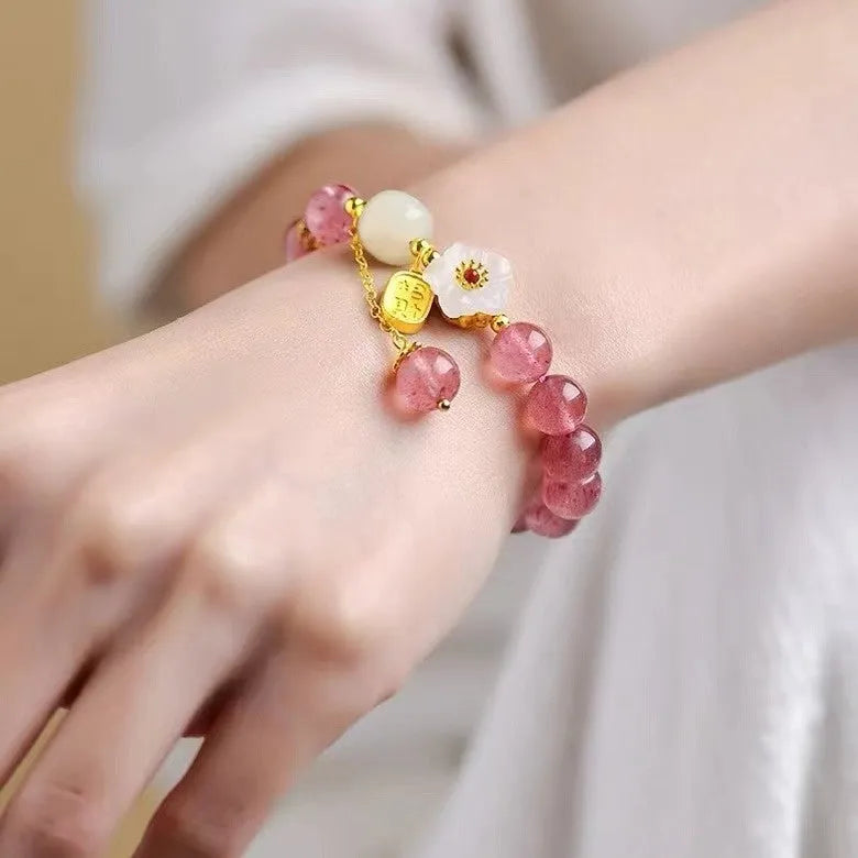 Handmade natural crystal bracelet with strawberry quartz decorative elements in pearl, moon, XINGX, or green design options