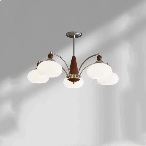 Traditional persimmon glass and chrome chandelier with multiple light heads for a dining room.