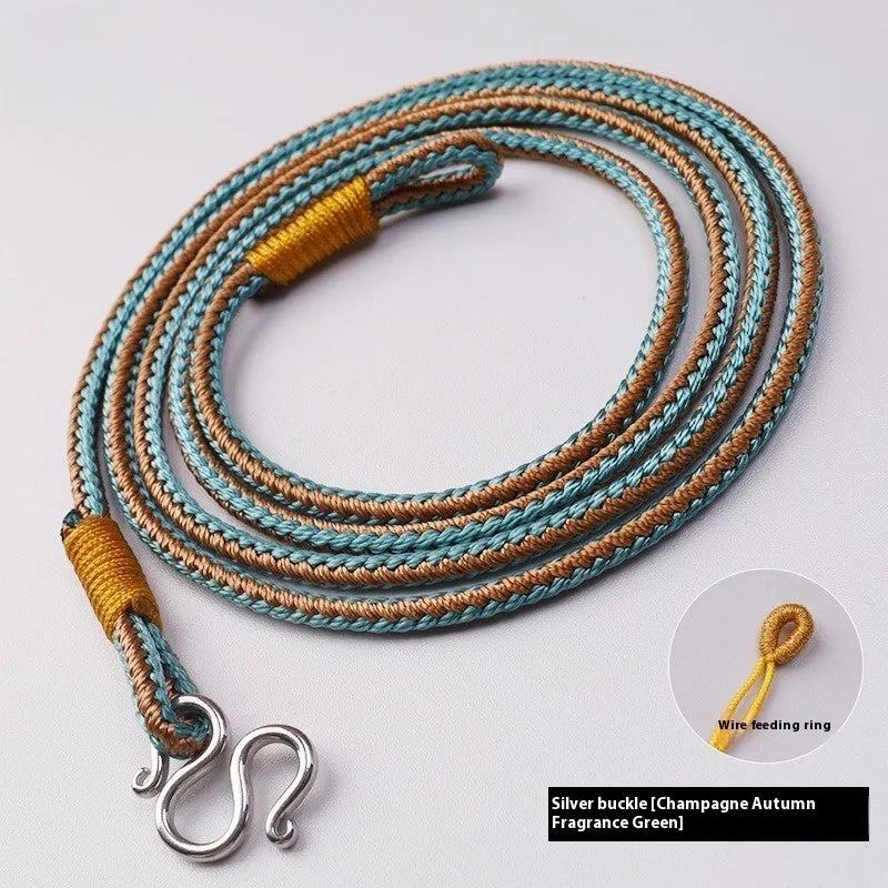 Gold and silver Thangka Peace Buckle jewellery with gem inlaid pendant on imitation pearl, showing pull ring.