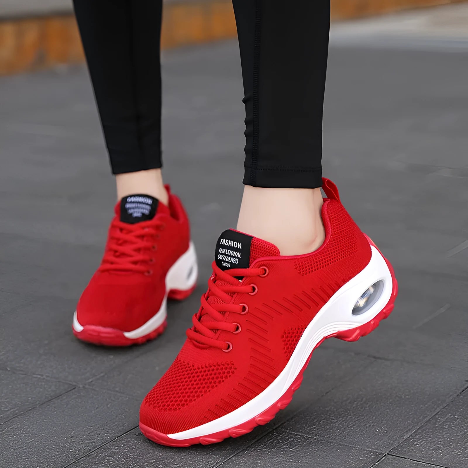 Women's red mesh sneakers with front lace-up design, round toe, and flat mid heel